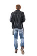 © sharplaninac - Back view of young blond hair man in leather jacket walking away holding phone looking down. Full body length isolated on white background