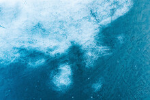 Aerial View Of Frozen Lake Ice Surface Texture In Spring Time Near Trakai, Lithuania.