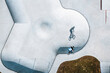 © AmazingAerialAgency - Aerial view of BMX bike rider silhouette shadow in concrete skate pool, Panevezys, Lithuania.