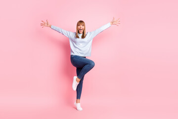 Wall Mural - Full length body size view of pretty funnhy cheerful girl having fun jumping isolated over pink pastel color background