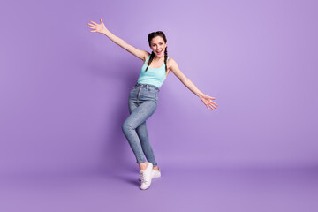 Poster - Full length body size view of attractive cheerful friendly girl dancing enjoying having fun isolated over violet purple color background