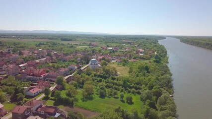 Sticker - A 4k rendering of a village with agricultural fields near the long river