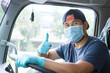 © Nuad Contributor - Truck drivers wear protective mask while driving.