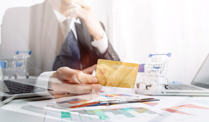 Business women reading document on office with tablet and graph financial diagram.Teamwork workplace strategy Concept.