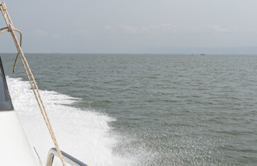 Boat sails to the island in the Gulf of Thailand.