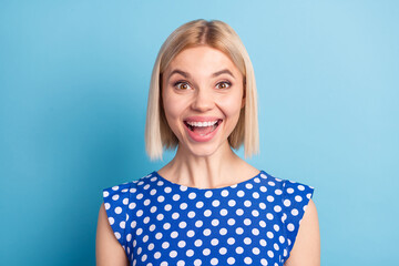 Photo of young cheerful girl happy positive smile excited good news sale isolated over blue color background