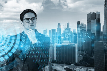 Poster - Eastern prosperous businessman in suit thinking about career opportunities at research and development department at international consultancy company. Hologram icons over Singapore background.