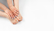 © amdre100 - Feet and hands with a turquoise pedicure on a white background.