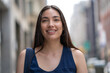 © blvdone - Young Latina Hispanic woman walking street smiling happy face