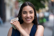 Young Latina Hispanic Woman Taking Off A Mask Smiling Face