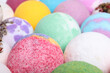 Colorful bath bombs as background, closeup view