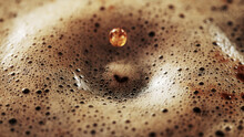 Freeze Motion Of Macro Shot Of Coffee Drop