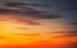 Fototapeta Mapy - Beautiful fiery orange sunset sky as background