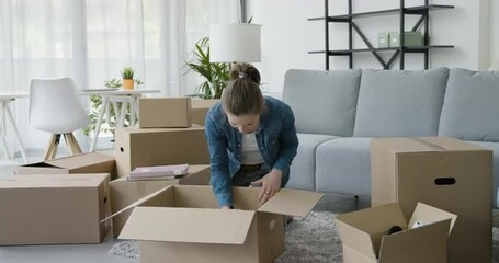 Wall Mural - Woman moving in her new home