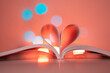heart book with magic lights stock photo