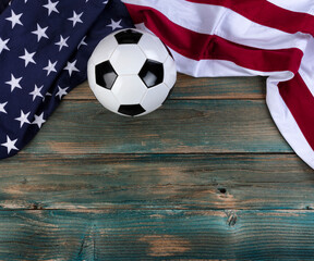 Wall Mural - US flag with soccer ball on faded blue wooden planks for sport concept