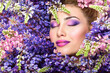 © Svetlana Fedoseeva - Beautiful woman face surrounded by violet flowers. Spring Flower. Springtime. Professional makeup,
