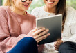 © Rawpixel.com - Women using digital tablet together