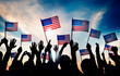 © Rawpixel.com - Group of People Waving American Flags in Back Lit