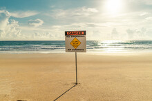 Sign On The Beach Danger No Swimming Rip Currents Sunset Lights