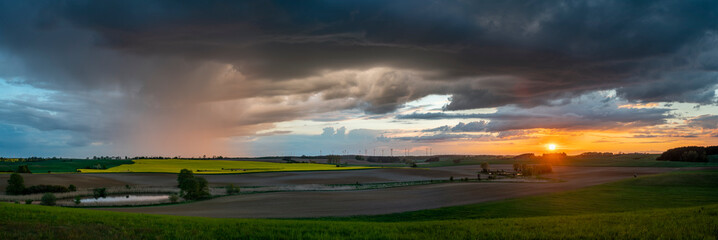 Wall Mural - Evening storm at sunset over the beautiful rural areas