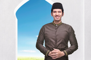 Wall Mural - Asian Muslim man standing