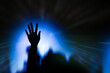 © aradaphotography - Hand raised up in a concert, religion concept.
