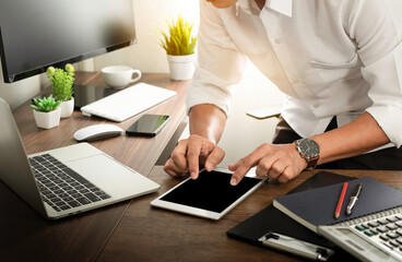 man hands using tablet and laptop computer on office table desk. Workspace, businessman working project idea for the job. Business investment-finance accounting and technology concept.