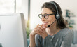 © StockPhotoPro - Woman wearing a headset and working with her computer