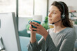 © StockPhotoPro - Woman wearing a headset and working with her computer