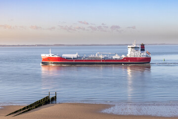 Boat passing by the beach in Vlissingen Holland