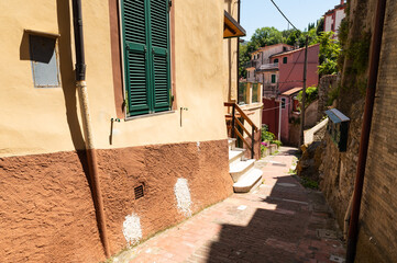 Wall Mural - Lerici, Liguria, Italy. June 2020. The alleys of the historic village offer fascinating glimpses with colorful houses and views towards the sea. Beautiful summer day. Nobody.