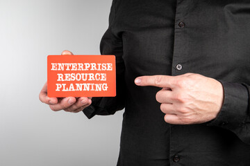 Canvas Print - Enterprise Resource Planning. Red sheet of paper in a business man's hand