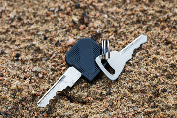 Aufkleber - two keys lie on the sand. loss of the keys to the house
