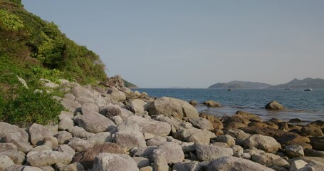 Sticker - Rock and stone beach with blue sky