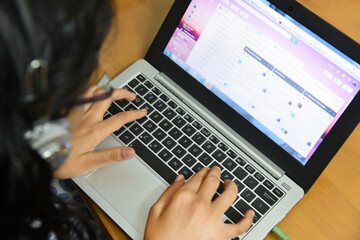 top down, flat lay, composition of a young woman chatting with friends using gmail chat program on h