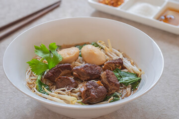 Wall Mural - Noodle soup with braised pork and pork balls in bowl, Thai food style