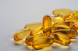 cod liver oil capsule ,fish oil ,food supliment with omega 3 ,heart care . on a white background .