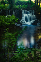 Wall Mural - Waterfall near the river beach of Mamoa