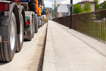 Trucks parked on the street and ready to transport construction materials