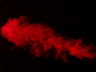 Red smoke on black background