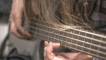 musician playing guitar, close up