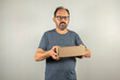 © Celso Pupo - merchandise delivery man with a box in hand