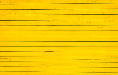 Wall Mural - Surface of wooden boards painted with yellow paint. Background Texture. 