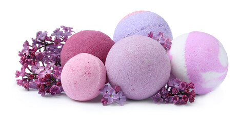  Fragrant bath bombs and lilac flowers on white background