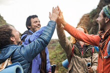 Group Of Happy Trekkers Stacking Hands Outdoor - Trekking And Travel Concept - Main Focus On Hands