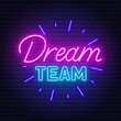 Dream Team neon sign on brick wall background.