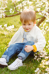 portrait of a fashionable little boy in nature