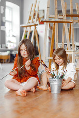 portrait of two girls sisters in studio