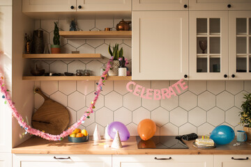 Wall Mural - Party table with birthday cake with candles, balloons and colored decor